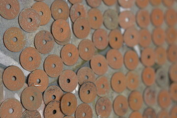 Scattered Pile of Antique Copper Coins with Center Holes © Mas