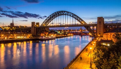 Fototapeta premium A nighttime cityscape with a large steel arch bridge