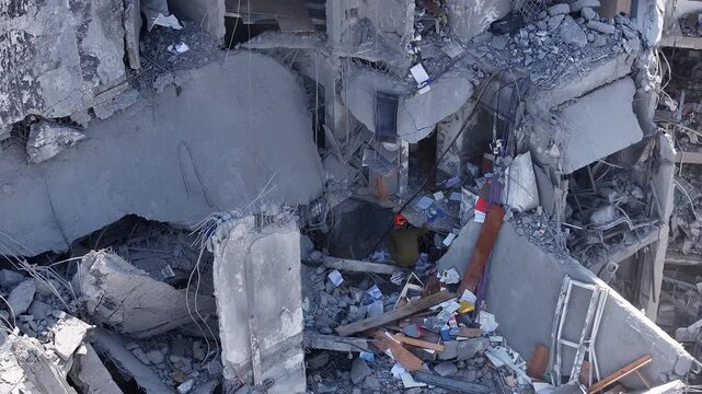 Aerial view Holon Iranian missile strike destruction Israel

Drone footage showing rescue teams at missile impact site in Holon residential area Israel June 14 2025

