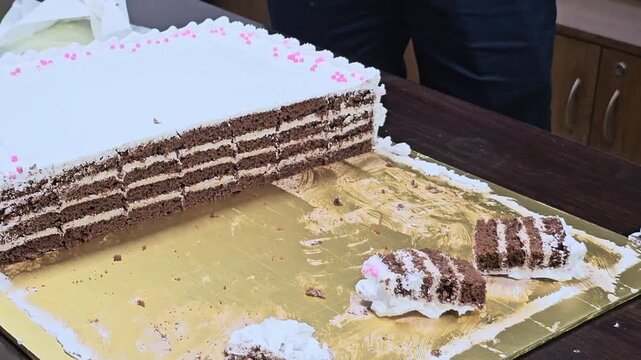 Delicious Cake Cutting Close-Up. Soft Creamy Dessert Slice in Celebration Moment.