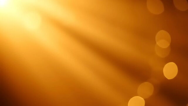 Golden yellow sun rays and warm light effects create a glowing abstract background with soft bokeh, evoking a feeling of warmth and energy. Ideal for overlay or design elements