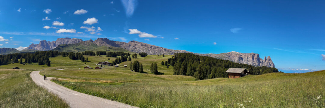 Panoramic view with the Rosengarten and the Schlern on the Seiser Alm in the Dolomites, South Tyrol, Italy.