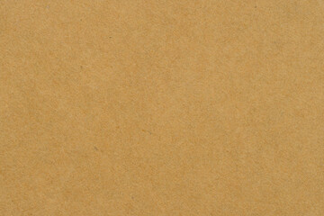 Fototapeta premium Brown Kraft Paper Texture Background with Natural Organic Fiber,Close-up of recycled brown kraft paper texture background, showing natural organic fiber and grainy detail. Ideal for eco-friendly.