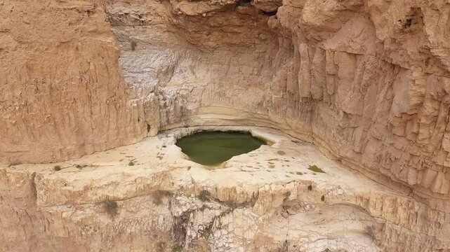 Aerial view desert canyon water pool Gav hever Israel

Drone footage capturing Gav hever canyon natural water pool desert cliffs Israel March 24 2026
