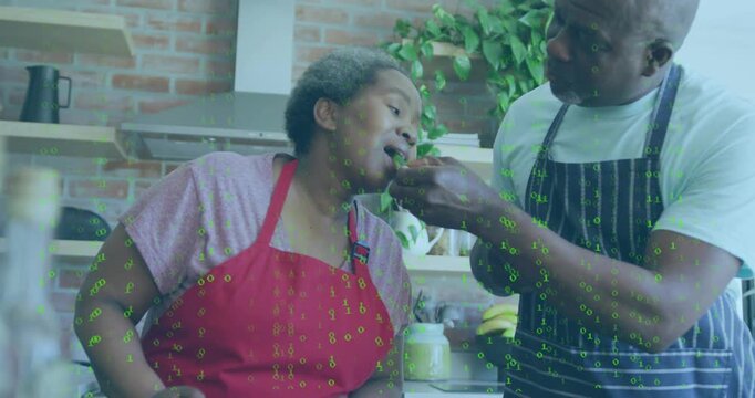 Man offering spoonful, woman leaning tasting, man resuming prep, checking taste, green code overlay