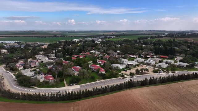Aerial Kfar Aza kibbutz landscape rural Israel

Drone footage Kfar Aza kibbutz homes and fields Israel October 7 2024
