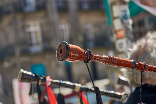 Detail of the carved wood of a Galician bagpipe drone at a popular Reconquista celebration in Vigo