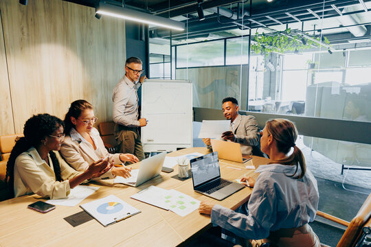 Conference room hosts negotiations between sales team and prospective buyer