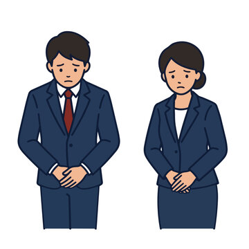 Japanese business man and woman in dark blue suits looking down with sad apologetic faces for apology or trouble