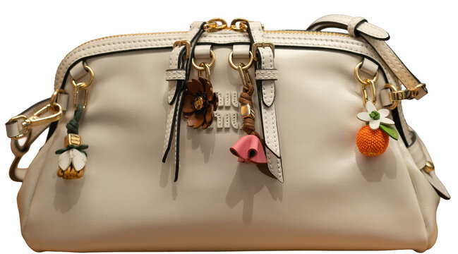 Miu Miu Caprice clutch bag in white leather with a logo on the front and colourful flower- and fruit-shaped charms.Milan - Italy,29 March 2026