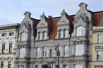 Fototapeta premium Ornate historic building facade with mansard roof and decorative elements