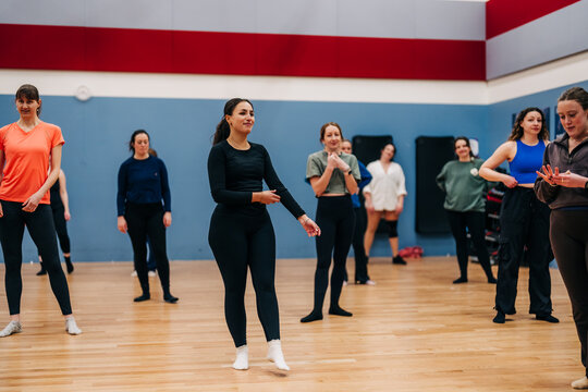Women learning choreography during a dance class rehearsal
