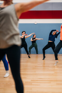 Women dancing choreography during rehearsal in studio