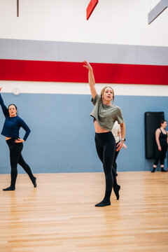 Female dancers rehearsing contemporary choreography in studio