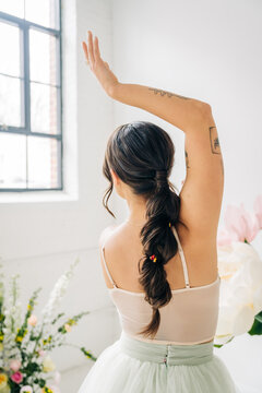 Woman with artistic braided ponytail and ballerina tutu