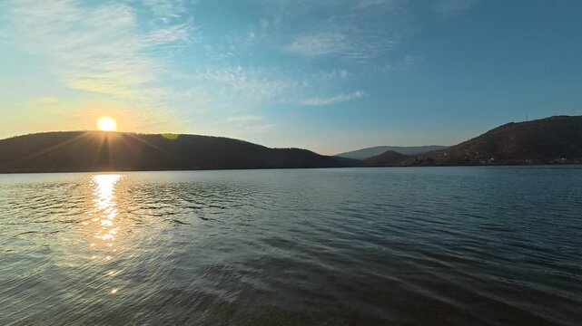 Static Wide-Angle Lake Shot with Gentle Pan &ndash; Sunset Behind Hills, Autumn. Location: Bovan Lake. Balkans, Serbia.