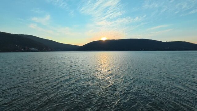 Slow Pan Across Lake &ndash; Sun Rays on Rippling Water, Autumn Evening. Location: Bovan Lake. Balkans, Serbia.