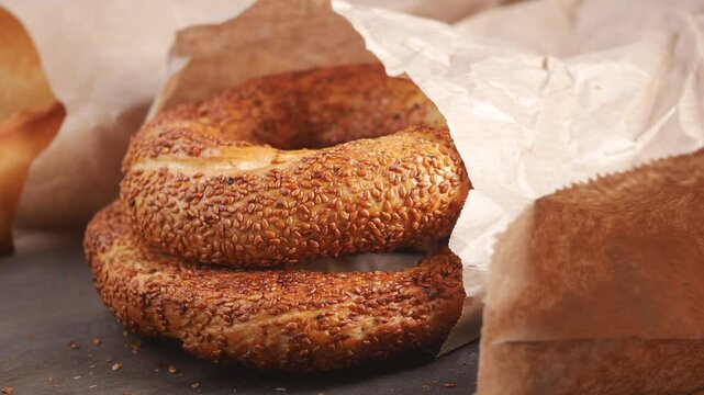 Soft bread rolls on a table with sesame seeds