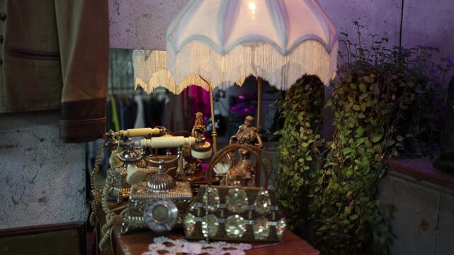 Vintage interior with retro telephone and decorative lamp creating warm nostalgic atmosphere antique objects and soft lighting evoke past era style and timeless design in cozy indoor space