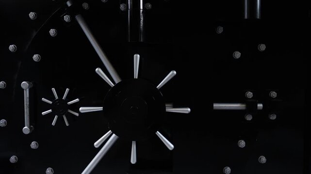 Massive bank vault door with metal locking mechanism and steel bolts close up symbol of security protection finance and safety strong secure storage concept