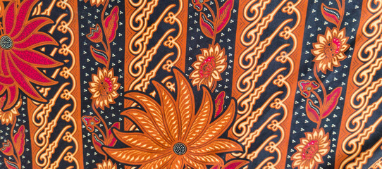background motif of traditional batik fabric from Indonesia © Dwi