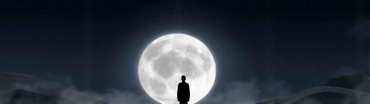 A silhouette of a person standing in front of a full moon