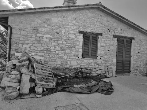 Montesanto, Umbria, Italy - September 24, 2025, perspective view of an old renovated farmhouse in the ancient medieval village of Montesanto.