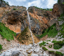Rinka waterfall in the beautiful Logar Valley in Slovenia during summertime.
