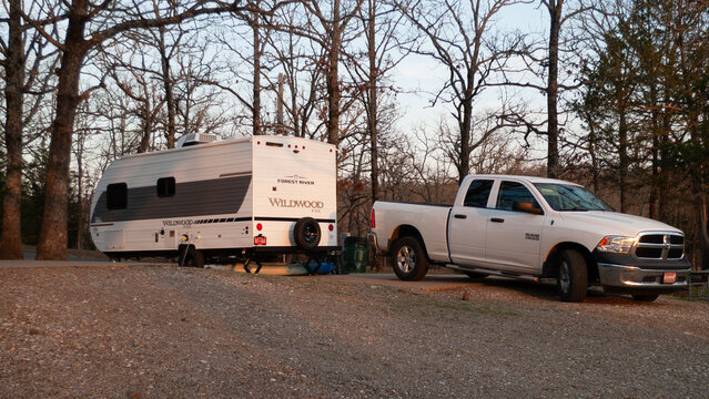 Forest River Wildwood camper and Dodge Ram Pickup at campsite