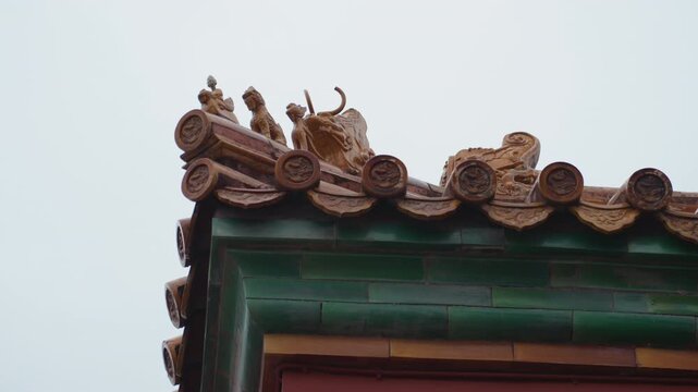 Ornate temple roof corner with dragon, ceramic tiles and green eaves, weathered patina under overcast sky, intricate carving and craftsmanship, close perspective highlighting texture and cultural