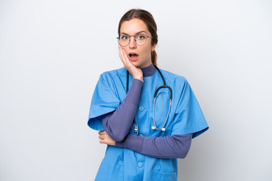 Young caucasian nurse woman isolated on white background surprised and shocked while looking right