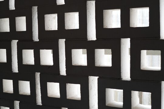 Abstract Geometric Pattern of White Concrete Breezeblock Wall with Light and Shadow