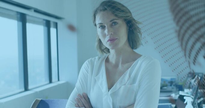 Woman standing by business window, dotted decal sweeping glass, straightening posture and preparing