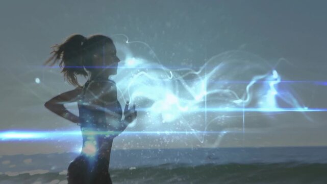 Woman entering left, jogging beachside while blue plasma overlay crossing silhouette for fitness