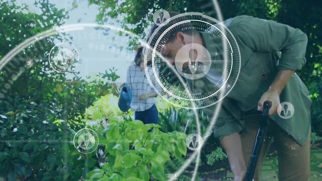 Man digging shovel while woman holding can, motion sending tech HUD overlays for garden data
