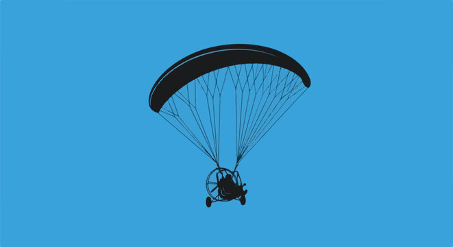 Silhouette of a powered paraglider soaring against a blue sky