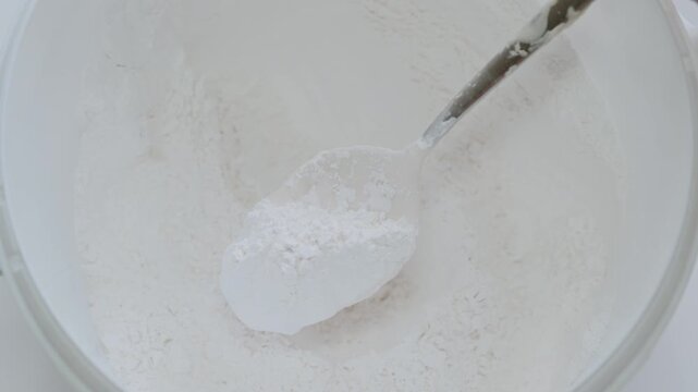 White All-Purpose Flour In Bowl With Measuring Scoop For Baking And Cooking Preparation