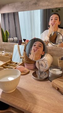 Teen Girl Doing Skincare Routine in Front of Mirror