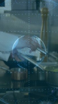 Vertical video: Chef turning fillets on grill, tossing veg, dotted globe overlay guiding cooking