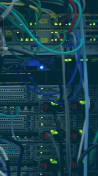 Vertical video: Camera panning across datacenter rack showing switches ports cables LEDs for audit