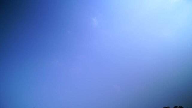 Clear blue sky gradient with soft clouds minimalistic nature background atmospheric tranquility and light azure