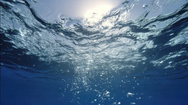 Pattern of water ripples on the surface, with subtle light play, suitable for use in posters, greeting cards, or as a design element for aquatic themes.