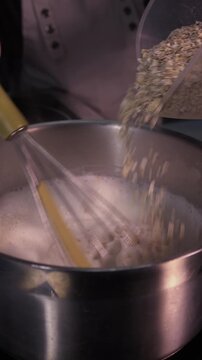 Cook the oatmeal in a pot, stirring with a whisk
