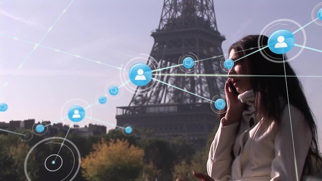 Animation of network of digital icons over woman talking on smartphone near eiffel tower