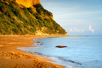 Gardenos beach with beautiful golden sand at sunset, Corfu coast, Greece. © Tomasz