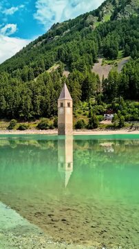 Sunken Bell Tower of Alt Graun in Lake Reschen South Tyrol Italy 4K