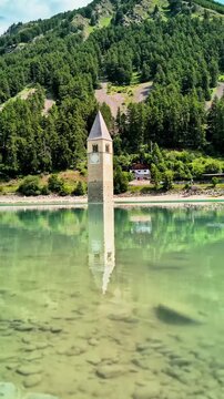 Sunken Bell Tower of Alt Graun in Lake Reschen South Tyrol Italy 4K