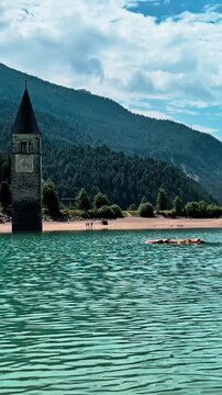 Sunken Bell Tower of Alt Graun in Lake Reschen South Tyrol Italy 4K