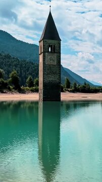Sunken Bell Tower of Alt Graun in Lake Reschen South Tyrol Italy 4K