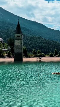 Sunken Bell Tower of Alt Graun in Lake Reschen South Tyrol Italy 4K
